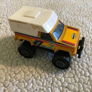 Vintage 1987 Remco Yellow Monster Truck with White Camper Shell Diecast Toy